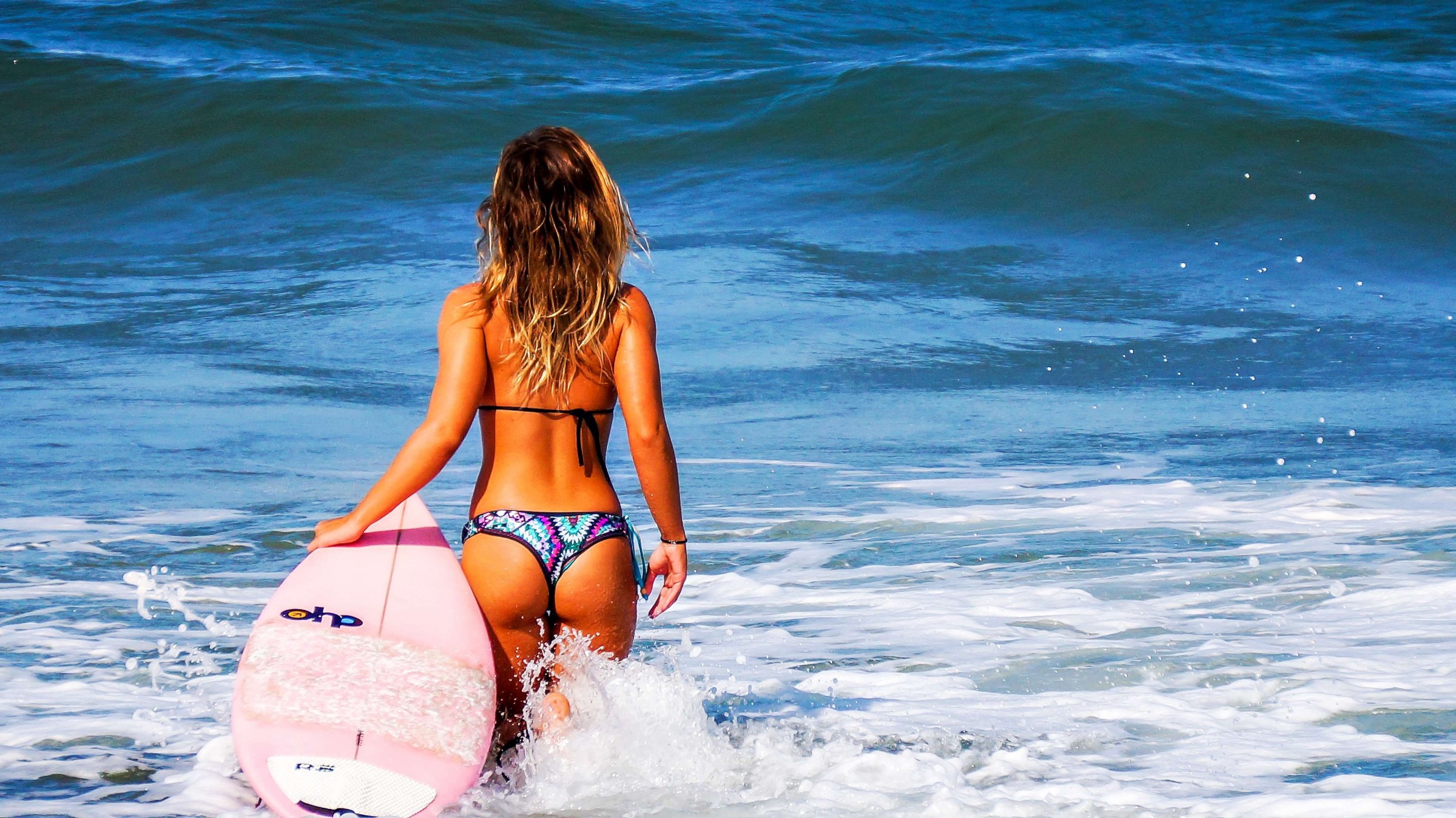 Young woman surfer
