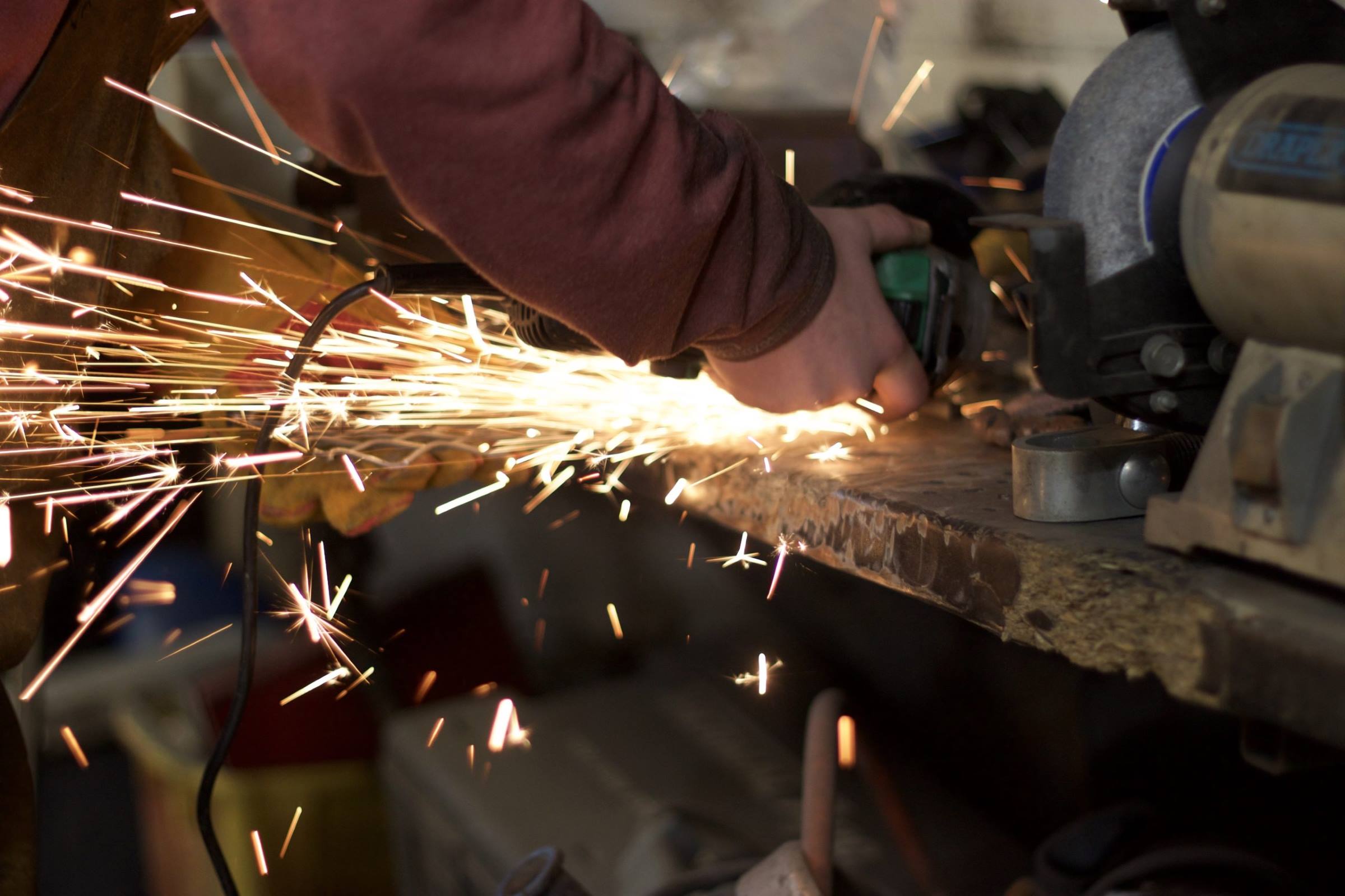 Worker grinder metal sparks