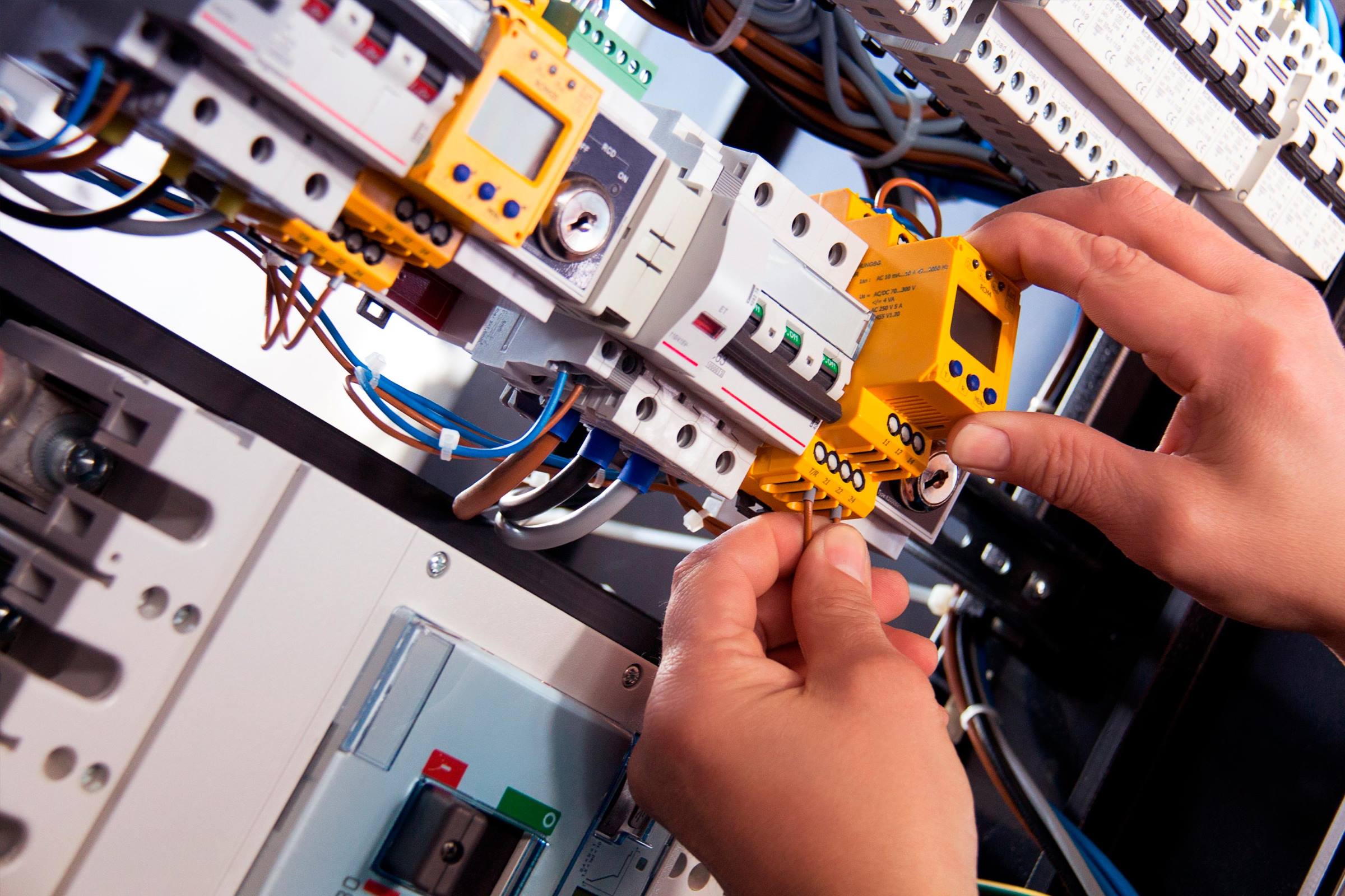 Electrician wiring a fuse board