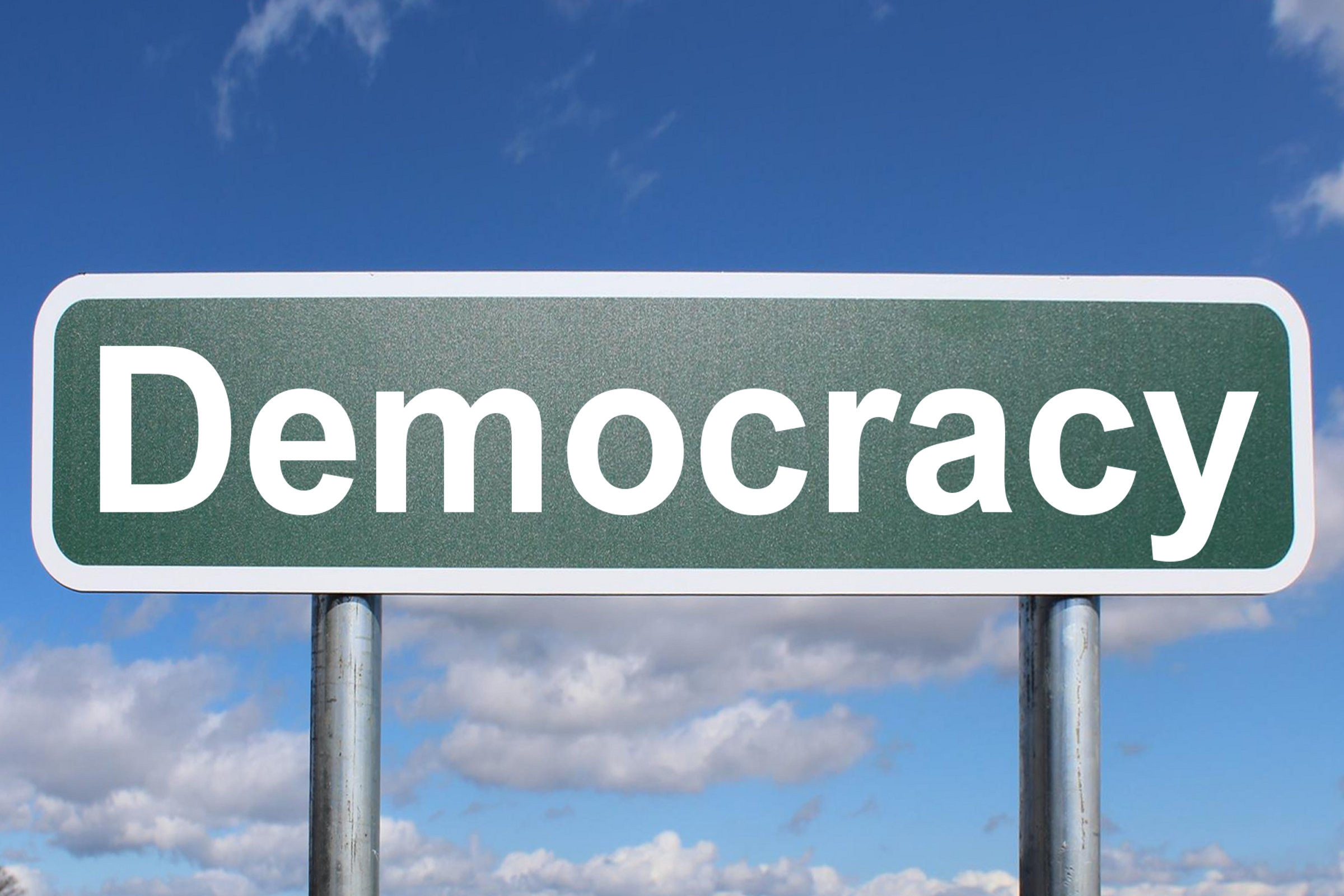 Democracy - Free of Charge Creative Commons Highway sign image