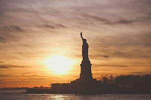 statue of liberty silhouette sunset river new york