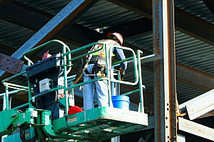 Workers hoist industrial